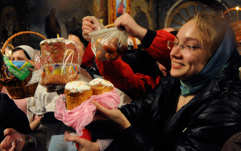 An Orthodox priest, unseen, blesses traditional Easter cakes and painted eggs prepared for Easter celebrations in the Kyiv-Pechersk Lavra church (Cave Monastery) in the capital city of Kiev. Orthodox Easter and Catholic Easter coincide this year. (AP)