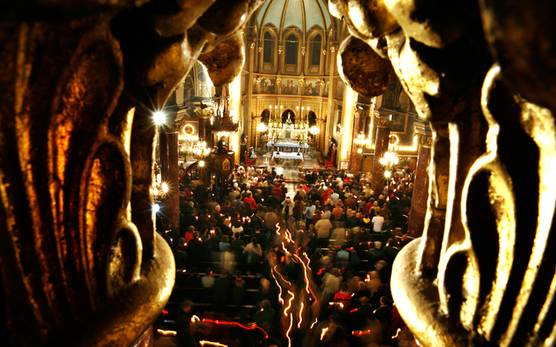 Romanian Roman Catholic worshipers attend an Easter religious service at the St. Iosif cathedral in Bucharest, Romania. Orthodox worshipers, which form the majority of Romanian people, celebrated Easter Sunday on the same day with Roman Catholics. (AP)