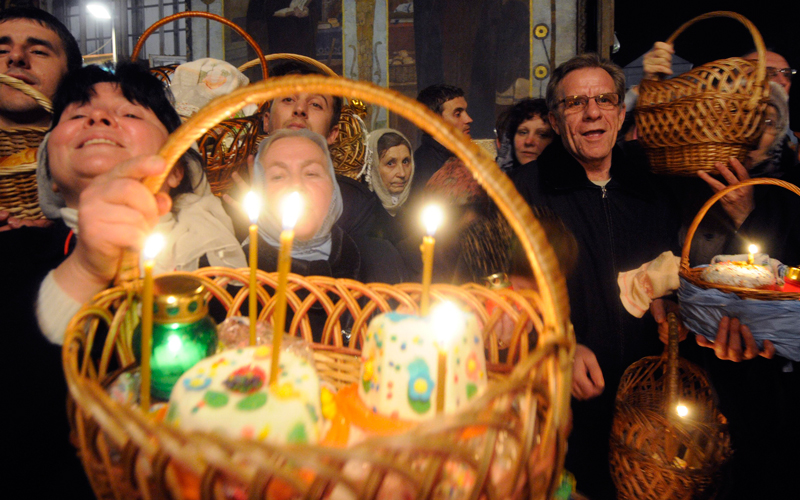 Ukrainian Orthodox believers light candles during a midnight Orthodox Easter service in the Kyiv-Pechersk Lavra church (Cave Monastery) in the capital city of Kiev. Orthodox Easter and Catholic Easter coincide this year. (AP)