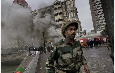 The iconic Taj Mahal hotel burns after gun battles between Indian troops and militants in Mumbai, India on Saturday. Indian commandos killed the last of the gunmen and ending a 60-hour rampage through India's financial capital. (AP)