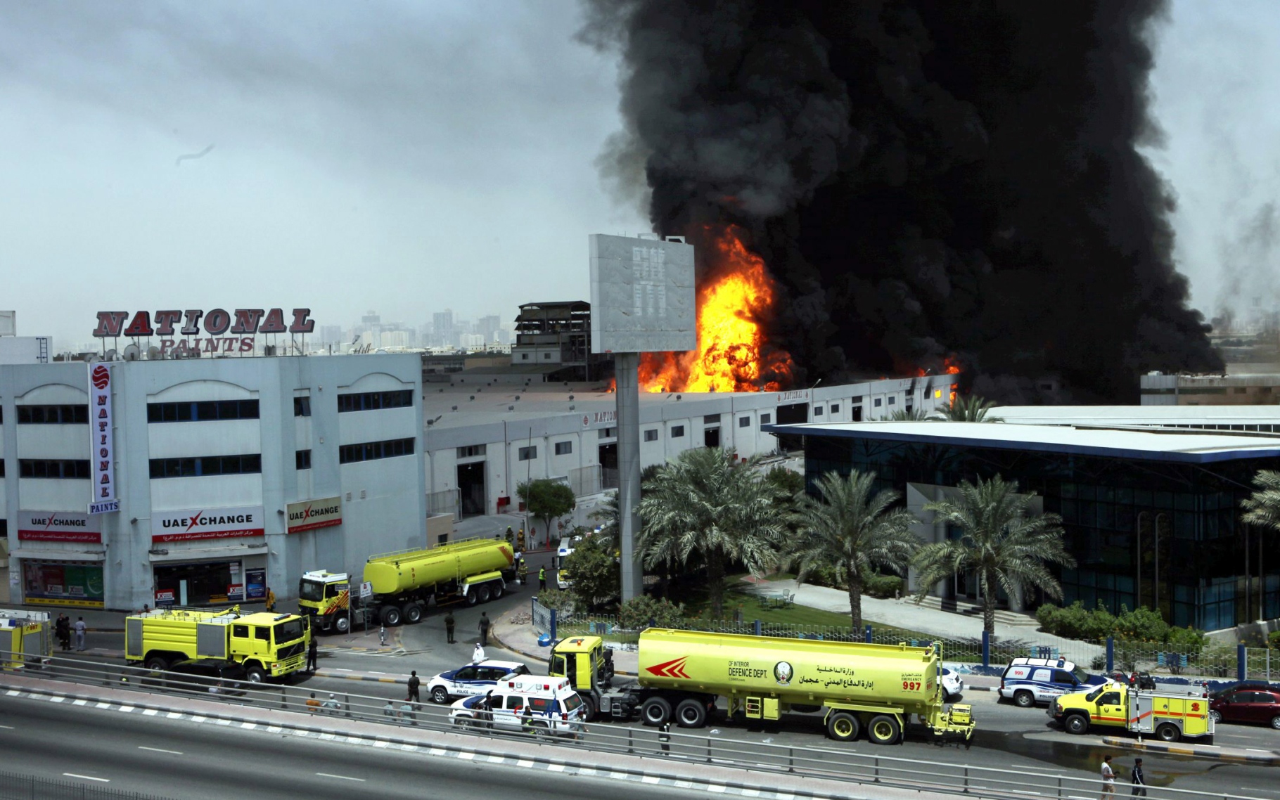 Smoke billows into the sky as flames engulf the National Paints factory in Sharjah on May 11, 2010. (OSAMA ABUGHANIM)