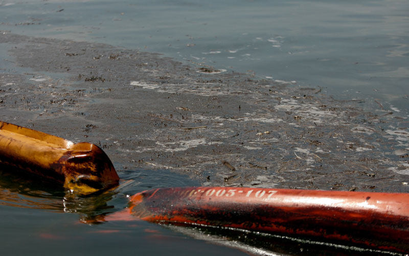 Oil breaches a hard boom that surrounds Cat Island off the coast of Louisiana on Monday, June 14, 2010. Oil from the Deepwater Horizon spill continues to impact areas across the Gulf Coast.  (AP)