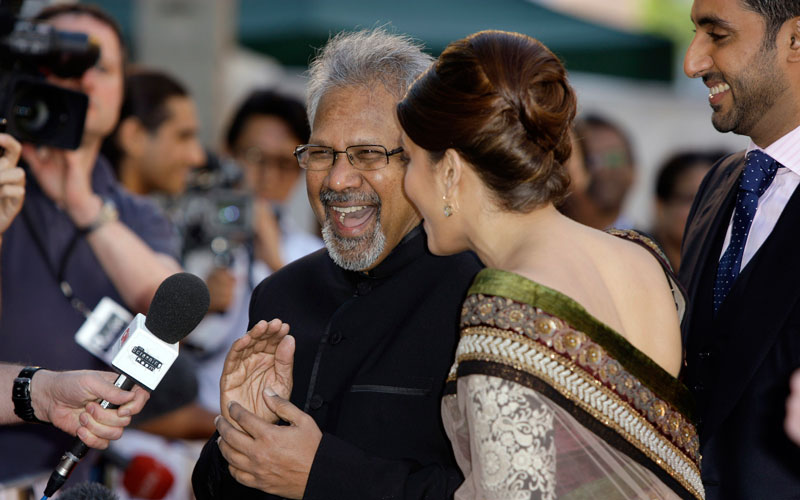 Indian director Mani Ratnam, centre left, reacts with Indian actress Aishwarya Rai Bachchan, on the red carpet for the World Premiere of the film Raaven, at the BFI, British Film Institute, in London, Wednesday, June 16, 2010. (AP)