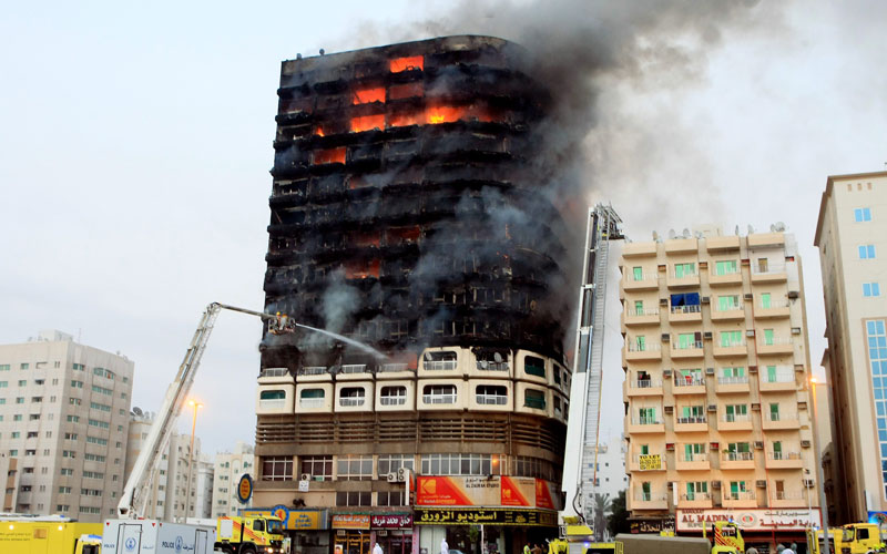 The fire broke out at about 5pm on one of the top storeys of the 15-floor Kuwait Tower building which has 72 flats and spread to other floors. (CHANDRA BALAN)