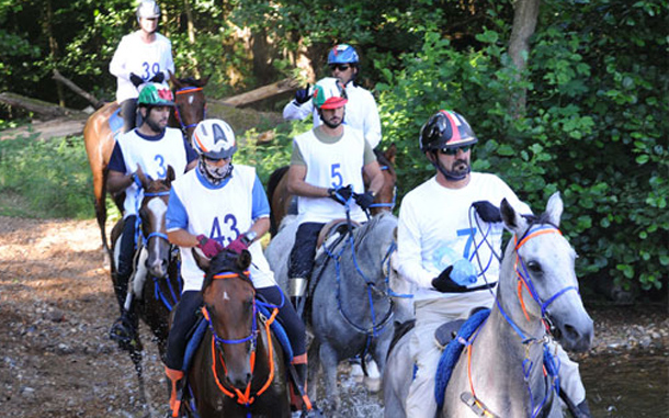 Sheikh Mohammed crosses a river with his team members during the endurance race in the United Kingdom. (www.sheikhmohammed.ae)