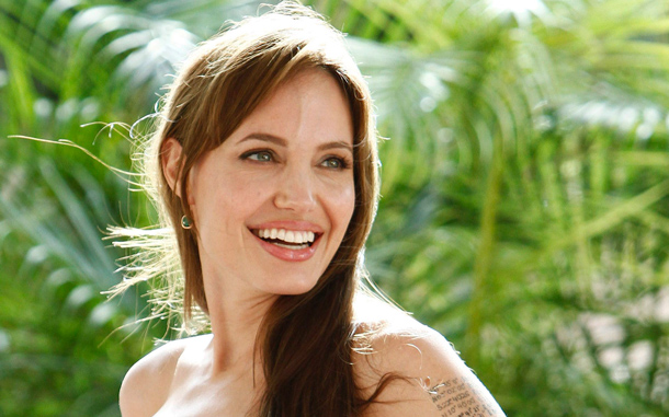Actress Angelina Jolie poses during the launch of her movie Salt in Cancun. (REUTERS)