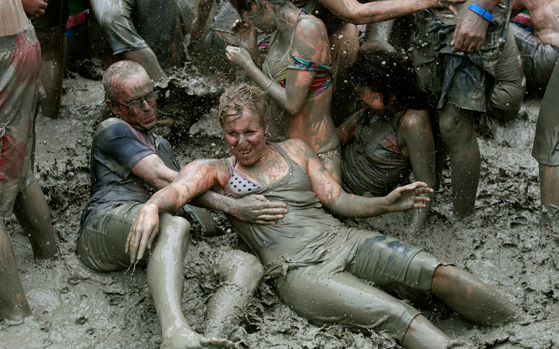 Participants at the 13th Annual Boryeong Mud Festival at Boryeong. Highlights are mud wrestling, mud sliding and a mud king contest. (GETTY IMAGES)