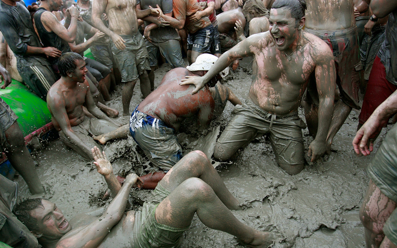Korean and foreign tourists flock to the festival. They may be separated by culture and language but they're all kids again, playing in the mud. (GETTY IMAGES)