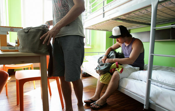 Youth british backpackers check-in in their bedroom at the Circus hostel Berlin, Germany. Millions of youth people taking a gap year between high school and college to see the world. Backpacking is the cheapest way to travel the world.  (Getty Images)