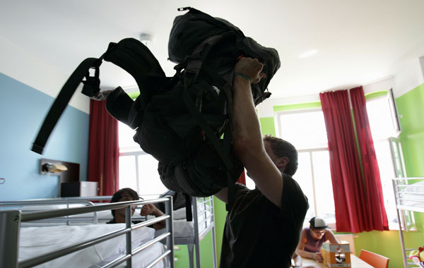 Youth british backpackers check-in in their bedroom at the Circus hostel Berlin, Germany. Millions of youth people taking a gap year between high school and college to see the world. Backpacking is the cheapest way to travel the world.  (Getty Images)