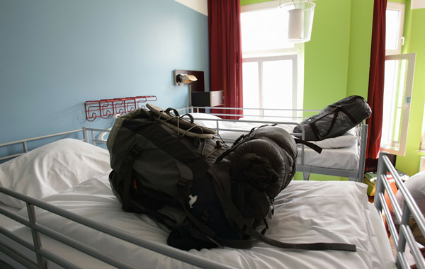 A backpack of a backpacker is pictured on a bed at the Circus hostel Berlin, Germany. Millions of youth people taking a gap year between high school and college to see the world. Backpacking is the cheapest way to travel the world.  (Getty Images)