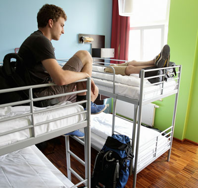 Youth british backpackers check-in in their bedroom at the Circus hostel, Germany. Millions of youth people taking a gap year between high school and college to see the world. Backpacking is the cheapest way to travel the world.  (/Getty Images)