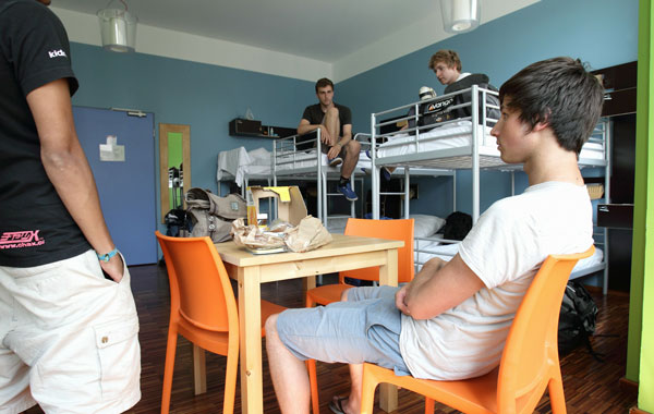 Youth british backpackers check-in in their bedroom at the Circus hostel Berlin on July 19, 2010 in Berlin, Germany. Millions of youth people taking a gap year between high school and college to see the world. Backpacking is the cheapest way to travel the world. (Getty Images)