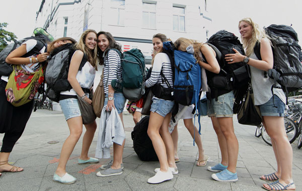 Backpackers of France stand outside the Circus hostel Berlin, Germany. Millions of youth people taking a gap year between high school and college to see the world. Backpacking is the cheapest way to travel the world. (Getty Images)