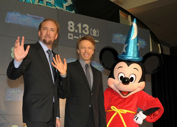 (L to R) Actor Nicolas Cage, producer Jerry Bruckheimer and Mickey Mouse attend the "The Sorcerer's Apprentice" Japan Premiere at Odaiba Cinema Mediage in Tokyo, Japan. The film open on August 13 in Japan. (GETTY IMAGES)