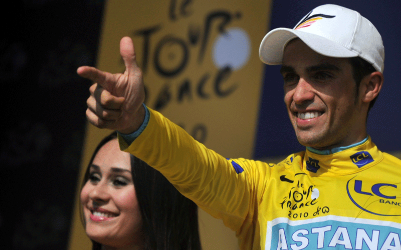 Yellow jersey of Overall leader, Spain's Alberto Contador, makes the Pistolero sign at the end of the 52 km individual time-trial and 19th stage of the 2010 Tour de France cycling race run between Bordeaux and Pauillac, southwestern France, on Saturday. (AFP)