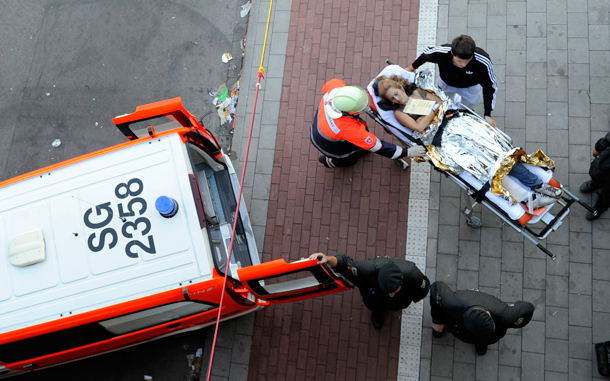A woman is carried to an ambulance after a stampede at the Love Parade "The art of Love" in the western German city of Duisburg. At least 10 people were killed in a stampede at the "Love Parade" techno music festival in Germany on Saturday, after overcrowding at an entrance gate sparked a stampede, police said. (REUTERS)