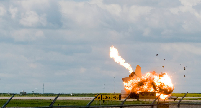 Pilot Capt. Brian Bews parachutes to safety as his a CF-18 fighter jet crashes and explodes during a practice flight at the Lethbridge County Airport. the weekend airshow in Lethbridge, Alberta, Canada. (AP)