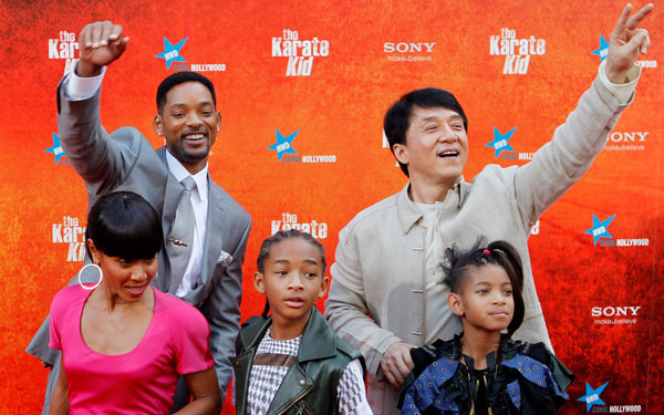 Actor and Producer Will Smith, top left, and director and actor Jackie Chan, top right, gesture with Smith's wife Jada, bottom left, and his children Jaden, centre and Willow before the Spanish premiere of the movie Karate kid, in Madrid. (AP)