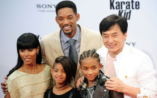 US actor Will Smith (behind, L) poses with (L-R) his wife Jada Pinkett, his daughter Willow Smith, his son Jaden Smith and Hong Kong born actor, producer and director Jackie Chan to promote the film "The Karate Kid" in Berlin. (AFP)