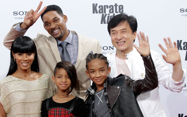U.S. actor and producer Will Smith (back L) poses for photographers with his wife Jada Pinkett Smith (L), their children Jaden (R) and Willow, and Chinese actor Jackie Chan as they arrive for the premiere of "The Karate Kid" in Berlin. (REUTERS)