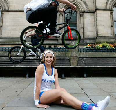 Professional BMX riders from Team Extreme vault over Gemma Atkinson at Albert Square. (GETTY IMAGES)
