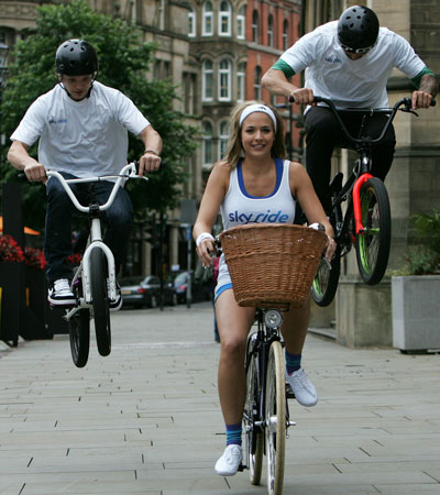 Professional BMX riders from Team Extreme jump alongside Gemma Atkinson at Albert Square. (GETTY IMAGES)