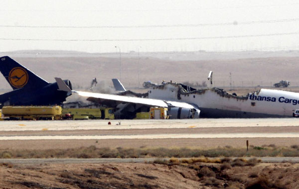 A Lufthansa MD-11 cargo plane is broken into two pieces after it crashed while attempting to land in Riyadh, Saudi Arabia. (EPA)