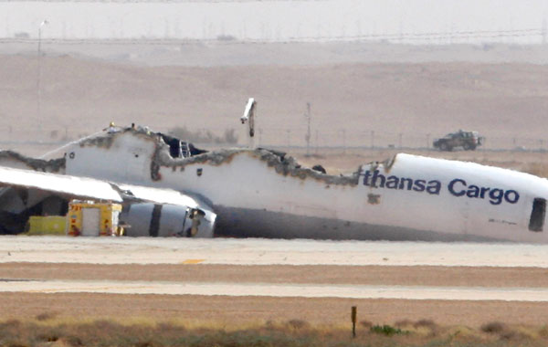 The German pilot and co-pilot of Flight 8460, which was carrying about 90 tons of unspecified cargo, were lightly injured, an airport official said. (AP)