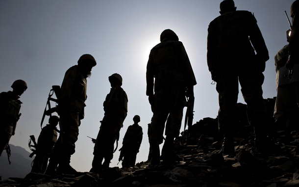 Pakistani soldiers stand on a hill in a village of the Sherwangi region of South Waziristan. Around 30,000 troops are taking part in the offensive against an estimated 10-12,000 militants in the semi-autonomous and lawless tribal belt. A massive cache of leaked Pentagon documents on the Afghan war highlights the role that Pakistan's intelligence service plays in destabilising Afghanistan, the president's spokesman said. Kabul has long accused Islamabad of providing support and sanctuary for militant groups that plan, fund and carry out attacks in Afghanistan. The whistleblowing website Wikileaks made public 92,000 Pentagon files and field reports about deaths of innocent civilians, Pakistani agents meeting the Taliban and Iran secretly furnished it with money, arms and training. (AFP)