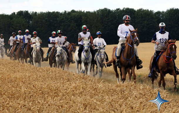 UAE riders stretch back through a field of corn. (SUPPLIED)