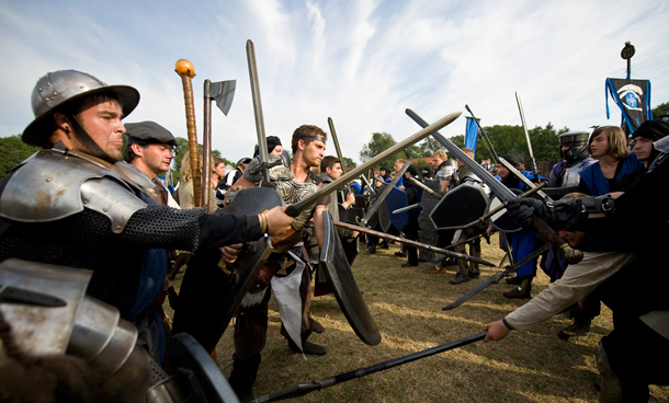Participants prepare to "fight" during 'Conquest 2010 LARP' (Live Action Role Play) in the northern German village of Brokeloh near Hanover. About 7000 participants from Europe, the United States and Japan dressed up as fantasy characters such as knights and trolls to take part in the three-day role playing event. (REUTERS)