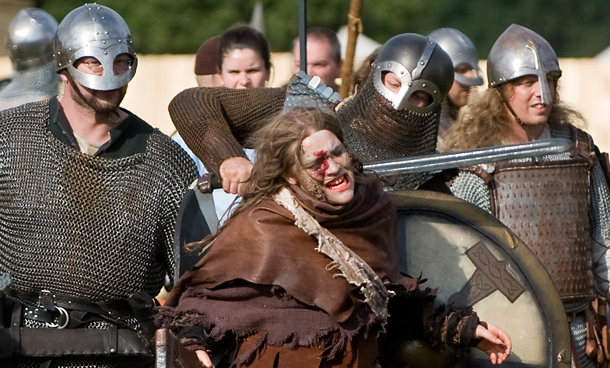 People in costumes participate in "Conquest 2010 LARP" (Live Action Role Play) in the northern German village of Brokeloh near Hanover. About 7000 participants from Europe, the United States and Japan dressed up as fantasy characters such as knights and trolls to take part in the three-day role playing event. (REUTERS)