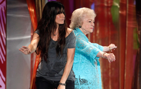 Actresses Sandra Bullock, right, and Betty White dance on stage at the Teen Choice Awards on Sunday, August 8, 2010 in Universal City, California (AP)