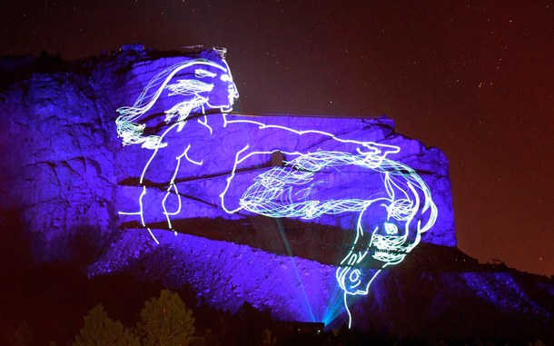 A laser drawing of what the finished  Crazy Horse Memorial will look like is projected onto the site at Thunder Mountain in the Black Hills during the laser light show near Custer, South Dakota. The massive undertaking, originally the creation and idea of Polish-American artist and sculptor Korczak Ziokowski, who started the undertaking in 1948, might be the largest sculpture in the world measuring when completed at 641 feet (195 m) wide and 563 feet (172 m) high. The head of Crazy Horse is 87 feet (27 m) high. (EPA)