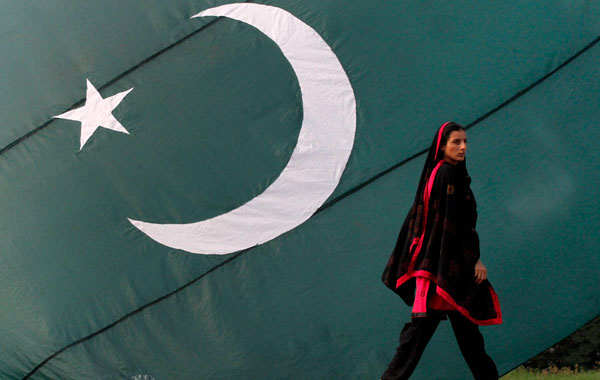 Pakistan Independence Day A woman walks past a Pakistan national flag on  display at a sidewalk in Lahore on the eve of the nation&#39;s Independence  Day. (REUTERS) Pakistani Navy cadets parade at the mausoleum of the father  of nation Quaid-e-Azam ...