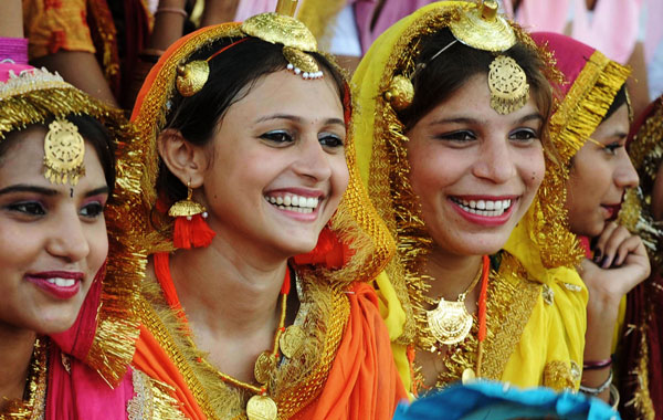 Indian students dressed as Punjabi giddha dancers attend an Independence Day parade rehearsal at Guru Nanak stadium in Amritsar. (AFP)