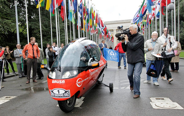 The electric vehicle of Oerlikon Solar Racing Team form Switzerland leaves the European headquarters of the United Nations after the start of the Zero Race Tour, in Geneva, Switzerland. (AP)