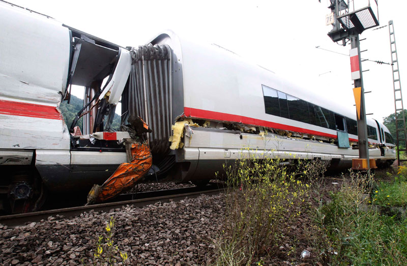 The destroyed and derailed Frankfurt-Paris InterCityExpress (ICE) highspeed train of German railway operator Deutsche Bahn AG is seen after a crash with a garbage truck in Lindenberg near Neustadt an der Weinstrasse. (REUTERS)