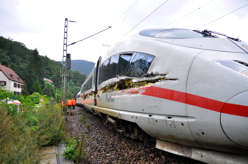 Rescuers stand next to an  InterCityExpress train after an accident near Lambrecht, Germany. (AP)