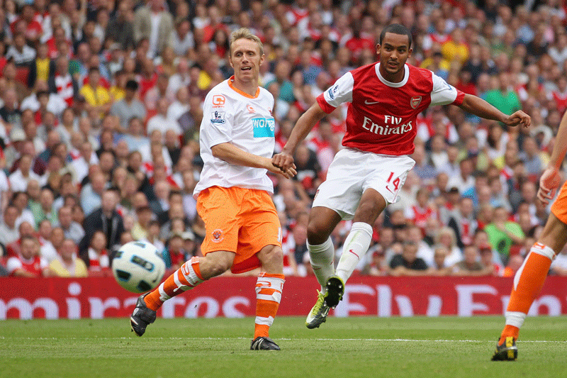 Arsenal striker Theo Walcott scoring his third goal against Blackpool. (GETTY)