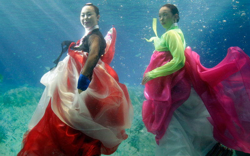 Models show off traditional Korean dress Hanbok, a creation by designer Park Sul-nyeo, during the Underwater Hanbok fashion show in Seoul, South Korea, Sunday. (AP)
