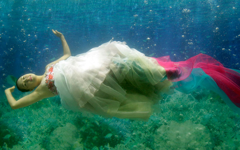 A model shows off traditional Korean dress Hanbok, a creation by designer Park Sul-nyeo, during the Underwater Hanbok fashion show in Seoul, South Korea, Sunday. (AP)
