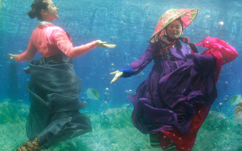 Models show off traditional Korean dress Hanbok, a creation by designer Park Sul-nyeo, during the Underwater Hanbok fashion show in Seoul, South Korea, Sunday. (AP)