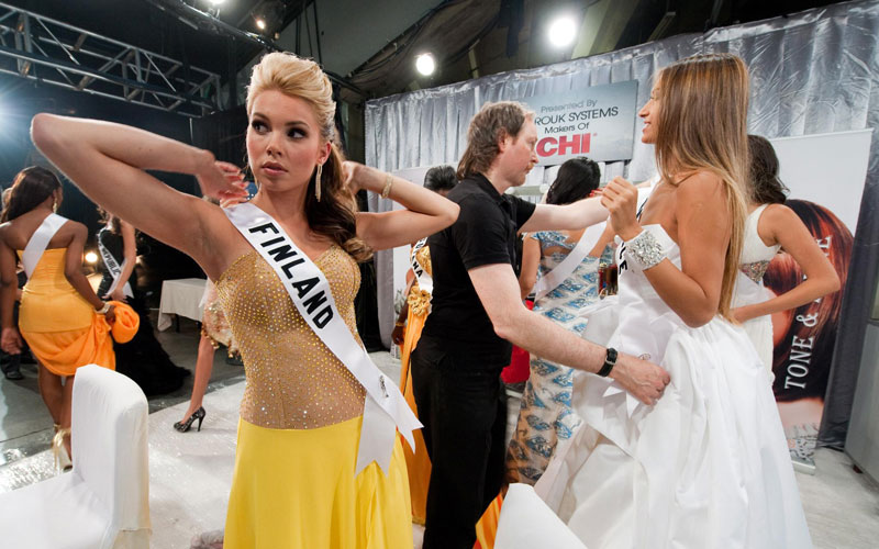 A handout picture provided by the Miss Universe Organization on 23 August 2010 shows Viivi Pumpanen, Miss Finland 2010 (L), and Anna Prelevits, Miss Greece 2010 (R), preparing backstage during the 2010 Miss Universe Presentation Show at Mandalay Bay Events Center in Las Vegas, Nevada, USA, 19 August 2010. (EPA)