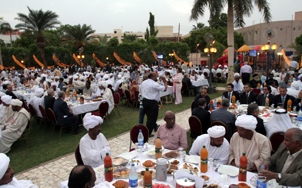 An annual Ramadan Iftar meal attended by Sudan's President Omar Hassan Al Bashir and members of the Sudanese Christian Orthodox community is seen in Khartoum, Sudan, on Monday. The meal is organised every year to express inter-religious harmony in the country. (EPA)