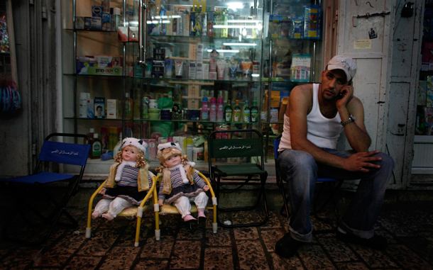 Arab man sits an a little stool next to two dolls in the Jerusalem's Old City. Muslims all over the world are celebrating the holy month of Ramadan, in which they abstain from eating, drinking and sexual relations from dusk to dawn. Ramadan is the holiest month in the Islamic calendar. (EPA)