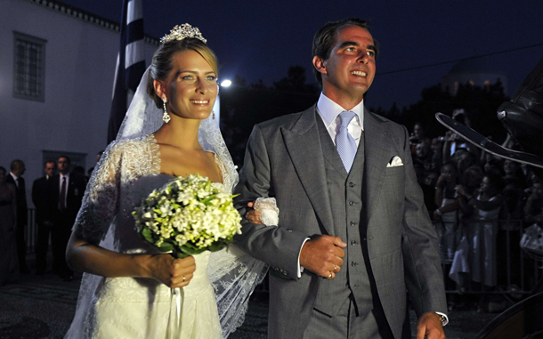 Tatiana Blatnik (L) and Nicolas, second son of Greece's former King Constantine leave the orthodox Church of Saint Nicolas after their wedding ceremony at the island of Spetses. Bluebloods from Denmark, Spain and Sweden attend the marriage ceremony of 40-year-old former prince Nicholas to Tatiana Blatnik, a 29-year-old event planner for fashion designer Diane von Fürstenberg. (AFP)