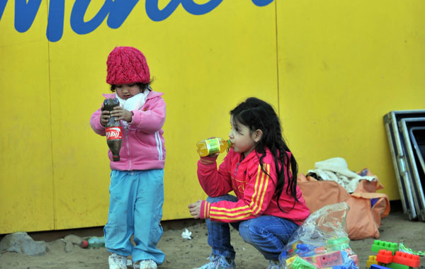 Children relatives of one of the 33 miners trapped inside the San Jose gold and copper mine in Copiapo, 800 km north of Santiago. (AFP)