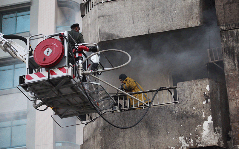 A residential apartment at the Karama street along the Airport Road caught fire on Saturday afternoon. Nearly 30 families in the building were evacuated safely, while several cars parked nearby were destroyed in the blaze. (Joseph Capellan)
